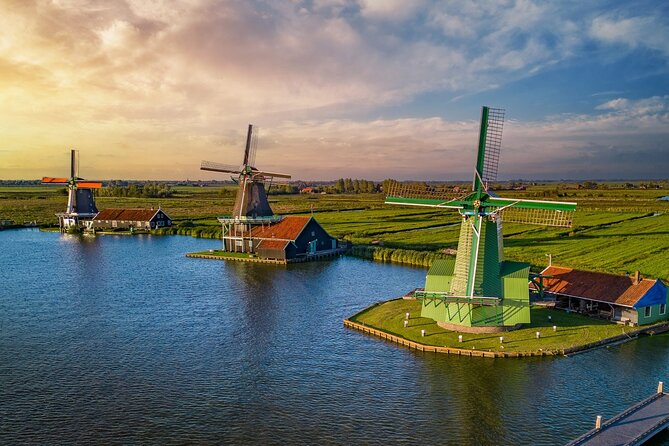 Traditional windmills beside waterways in the Dutch countryside